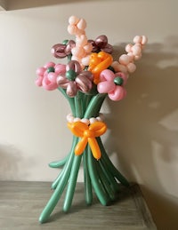 a bouquet of balloons in a vase on a table