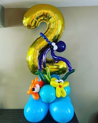 a birthday balloon decoration with a blue and gold number 2